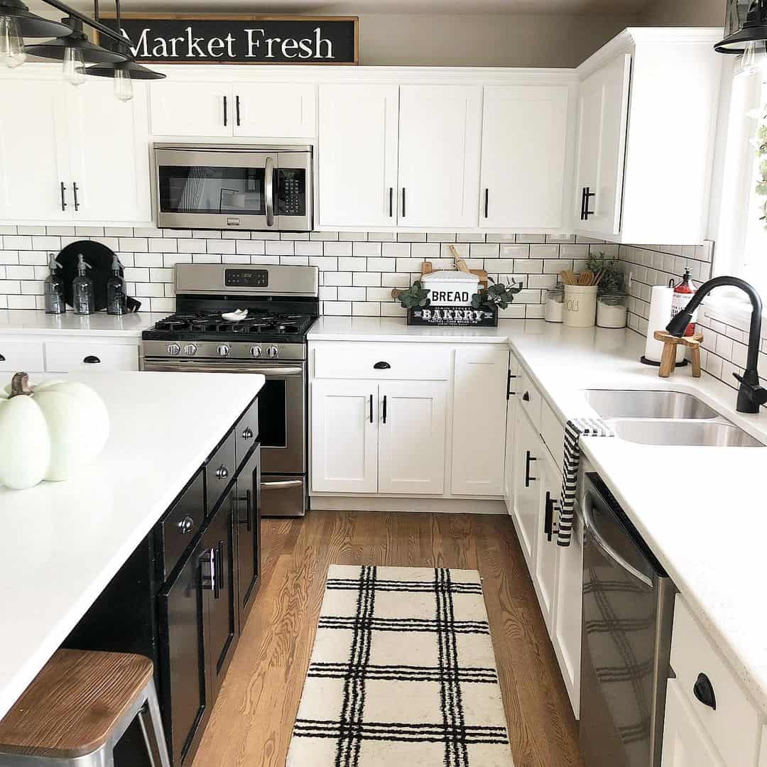 White Farmhouse Kitchen With Black Contrasting Island