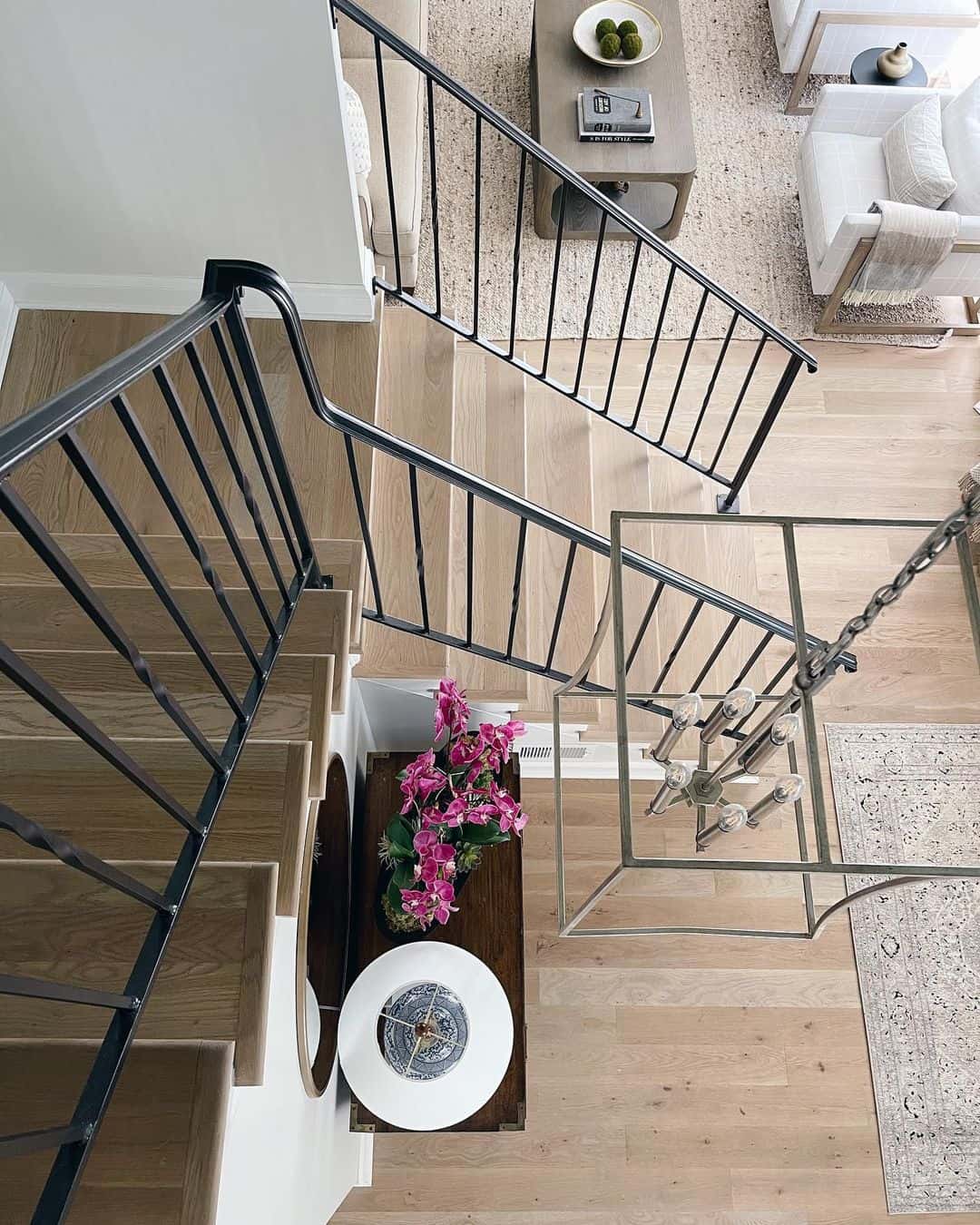 Light Wood Landing Stairs with Black Spindles