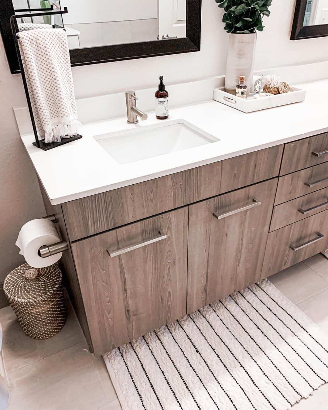 Stained Wood Vanity With Black Towel Holder