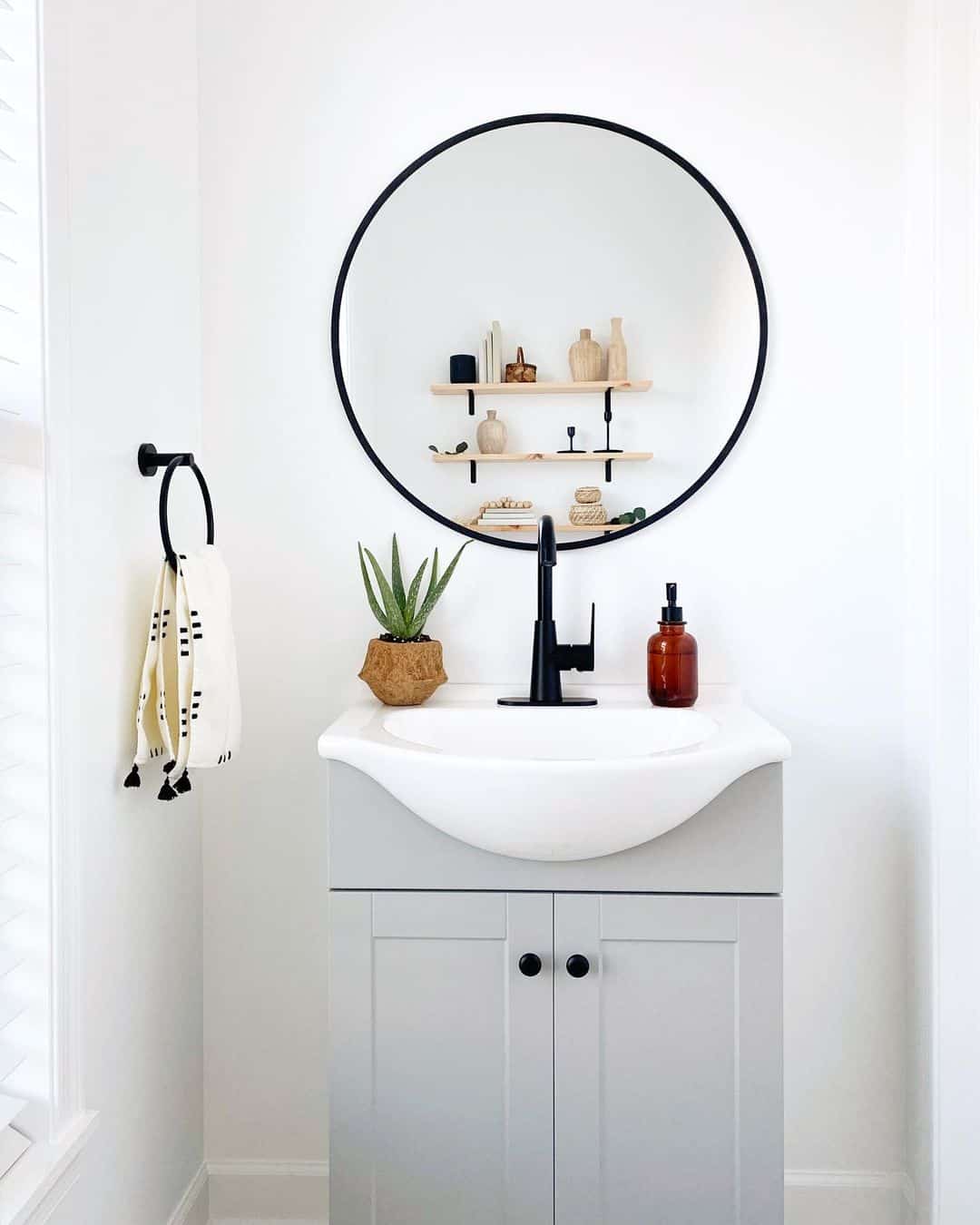 Gray Washstand With Black Circular Mirror