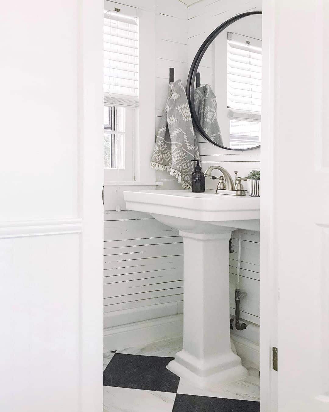 Half Bath With Black and White Design