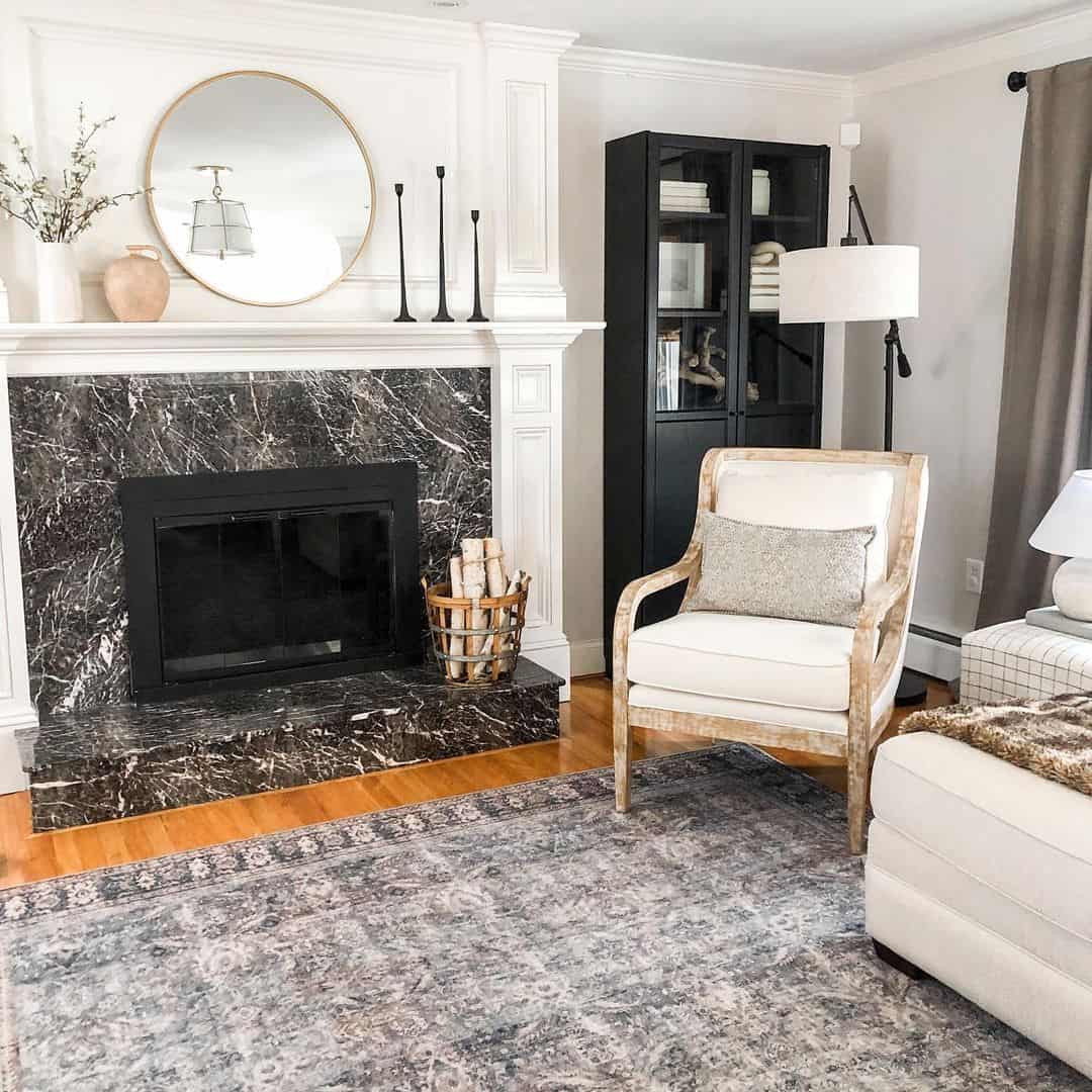Black Marble Fireplace With a Vintage Steel Firewood Basket