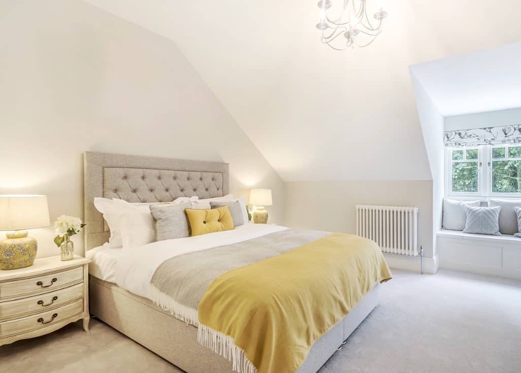 ]Neutral Upholstered Headboard Against a White Wall