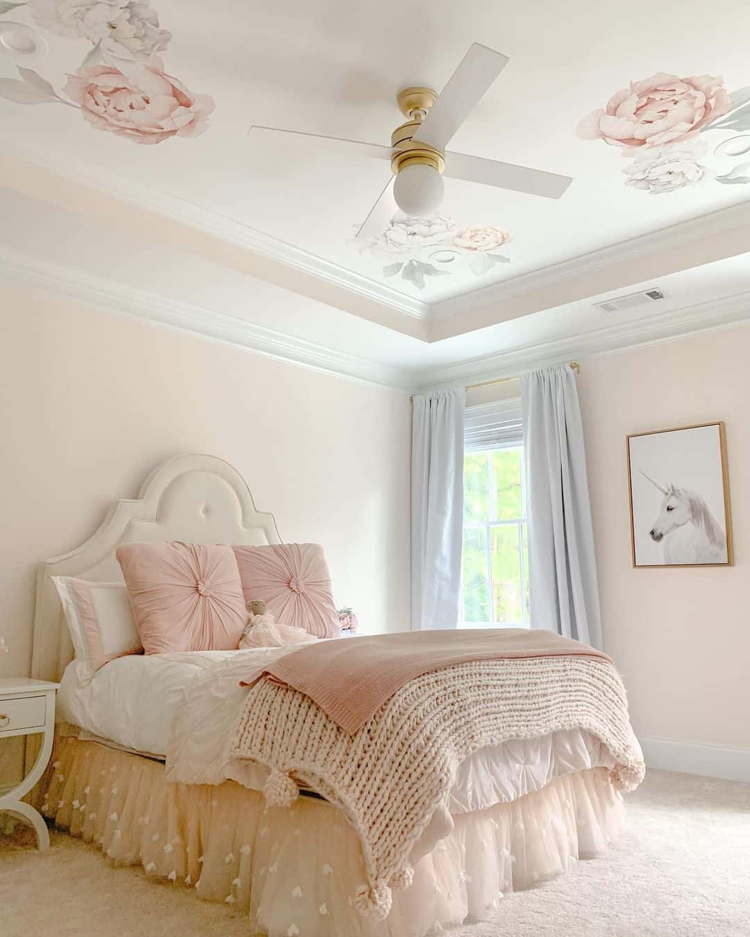Centering a Whimsical Bed Along a Peach-toned Wall