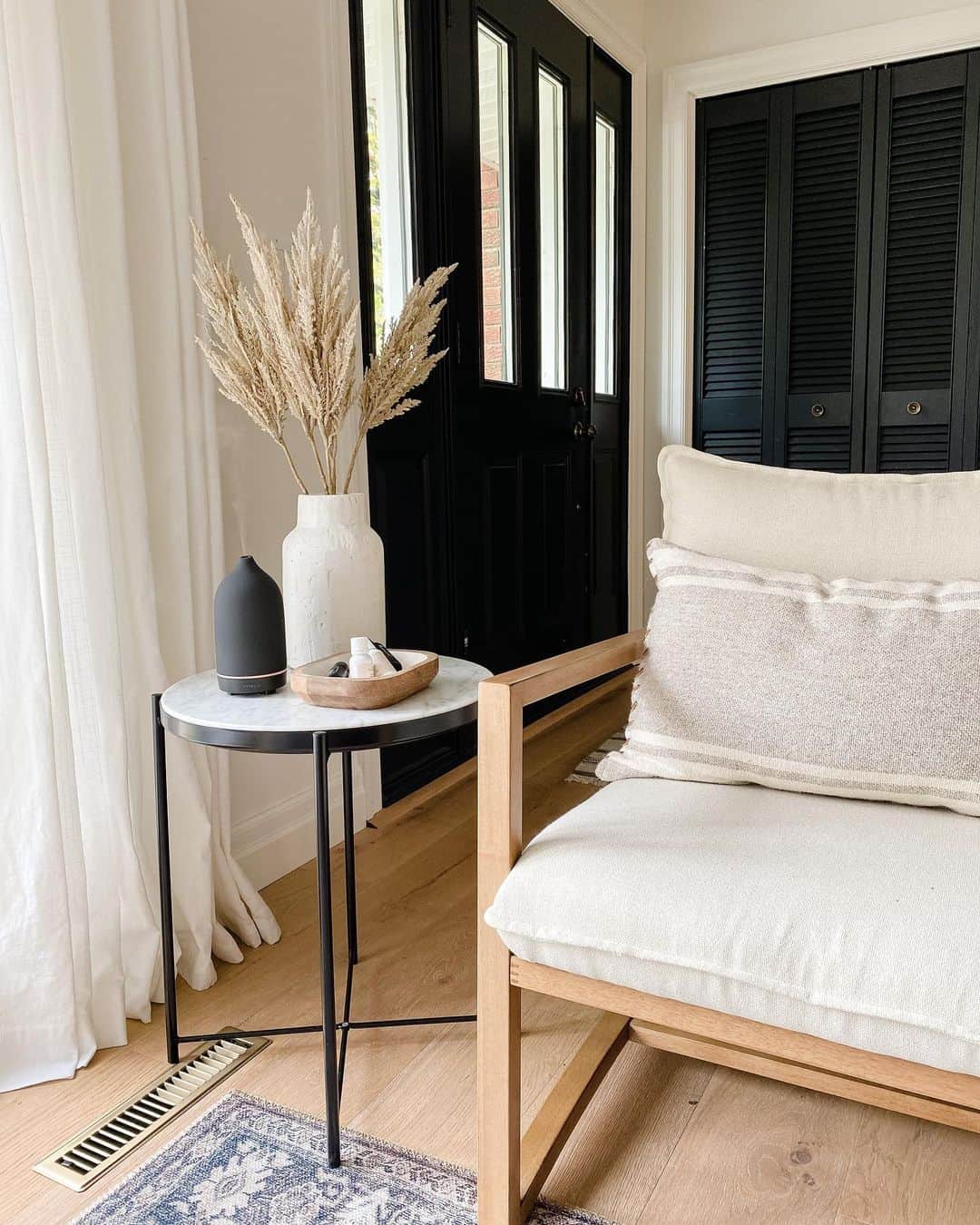 Bi-Fold Doors Behind Neutral Sitting Area