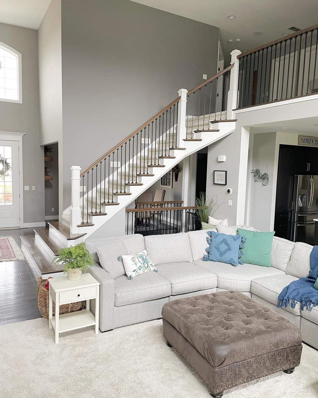 Beige Carpeted Staircase with White Stair Skirt Board