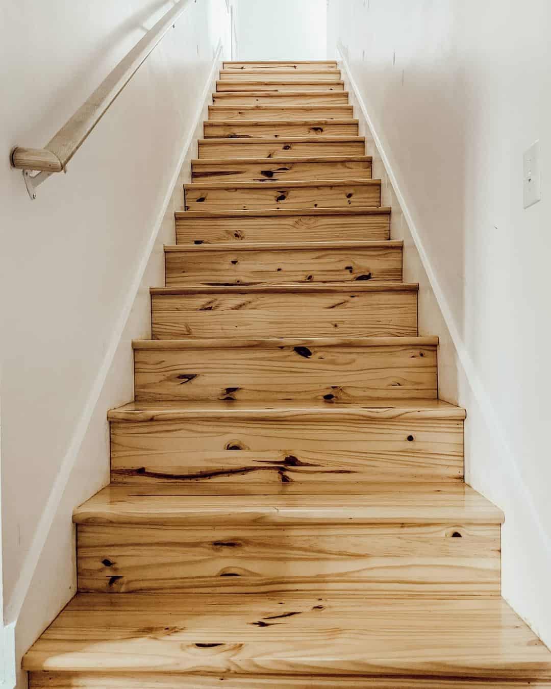 Light Wood Staircase with White Stair Skirt Boards
