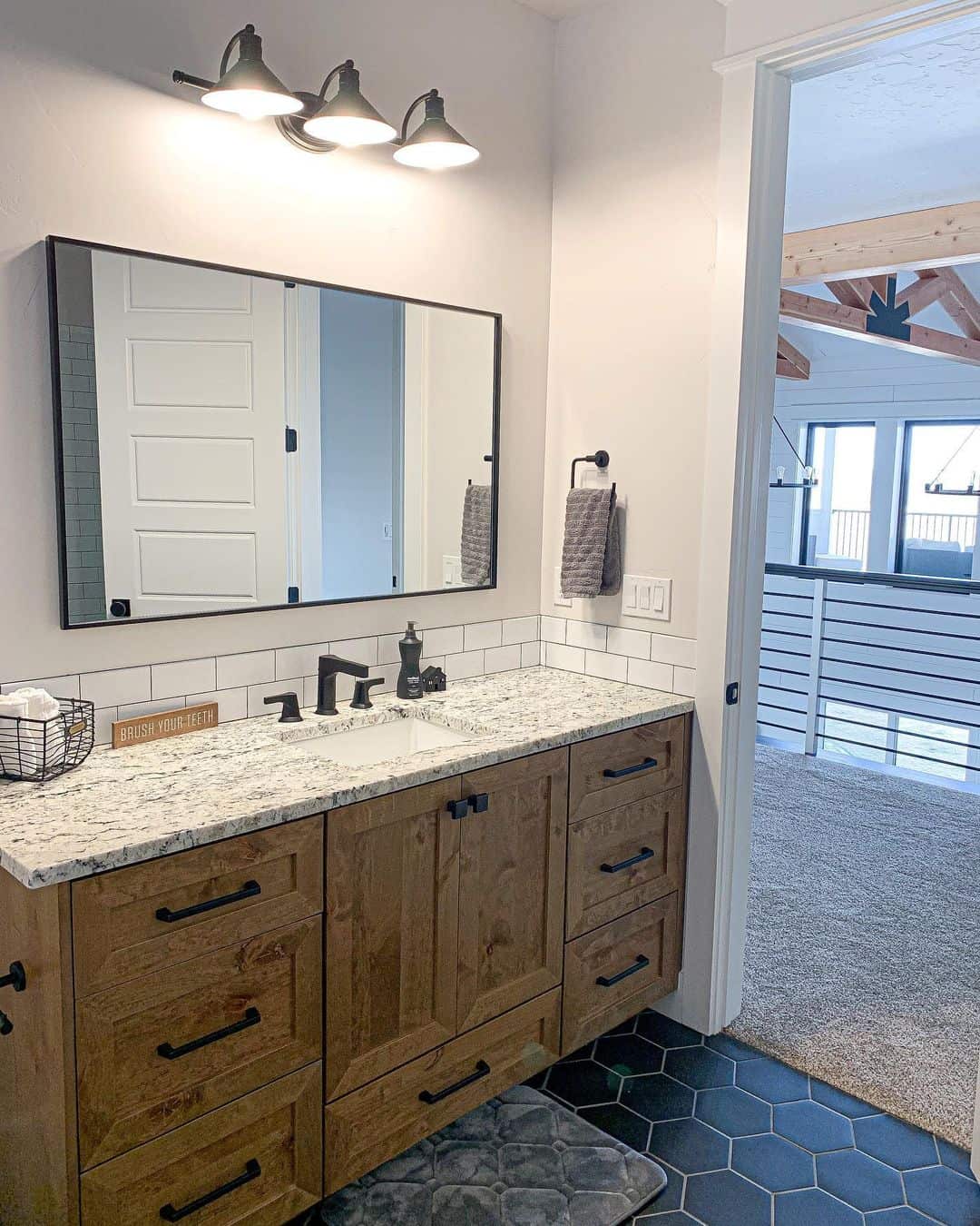 Stained Wood Vanity & Black Hex Tile